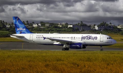 A JetBlue airplane about to take off at the airport.