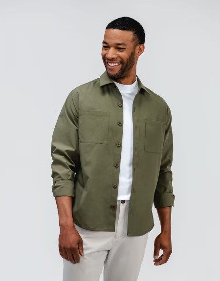 man in olive button up open over white tee
