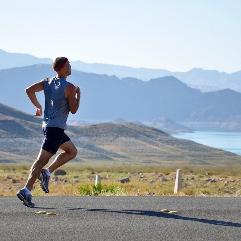 man running by mountain