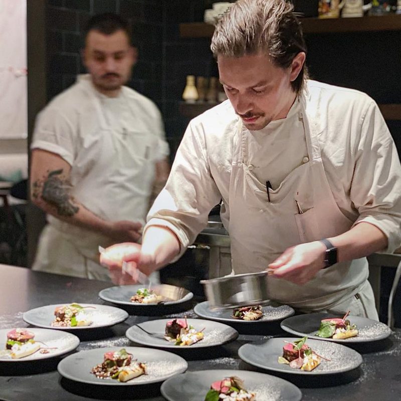 Preparing plates at Oriole in Chicago.