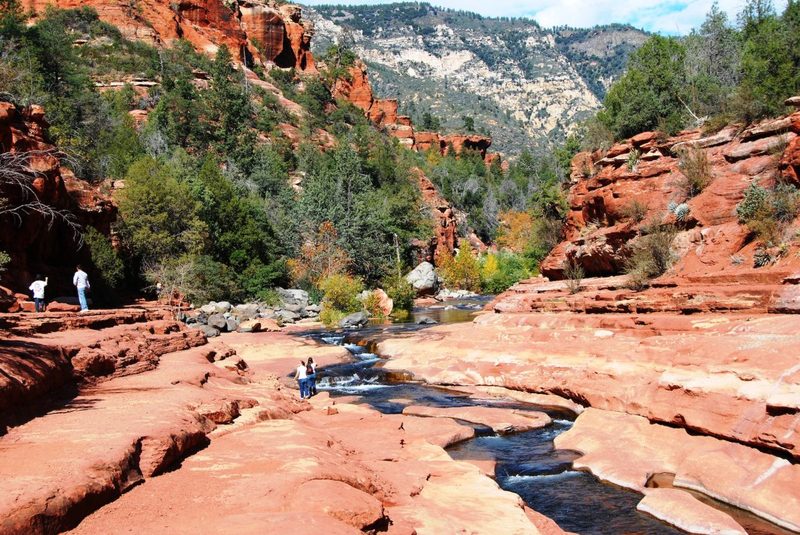 A beautiful picture of people enjoying a hike at a national park.