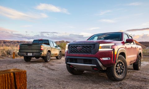 2022 Nissan Frontier Pro-4X front end and rear end angle in front of blue skies on a dirt trail