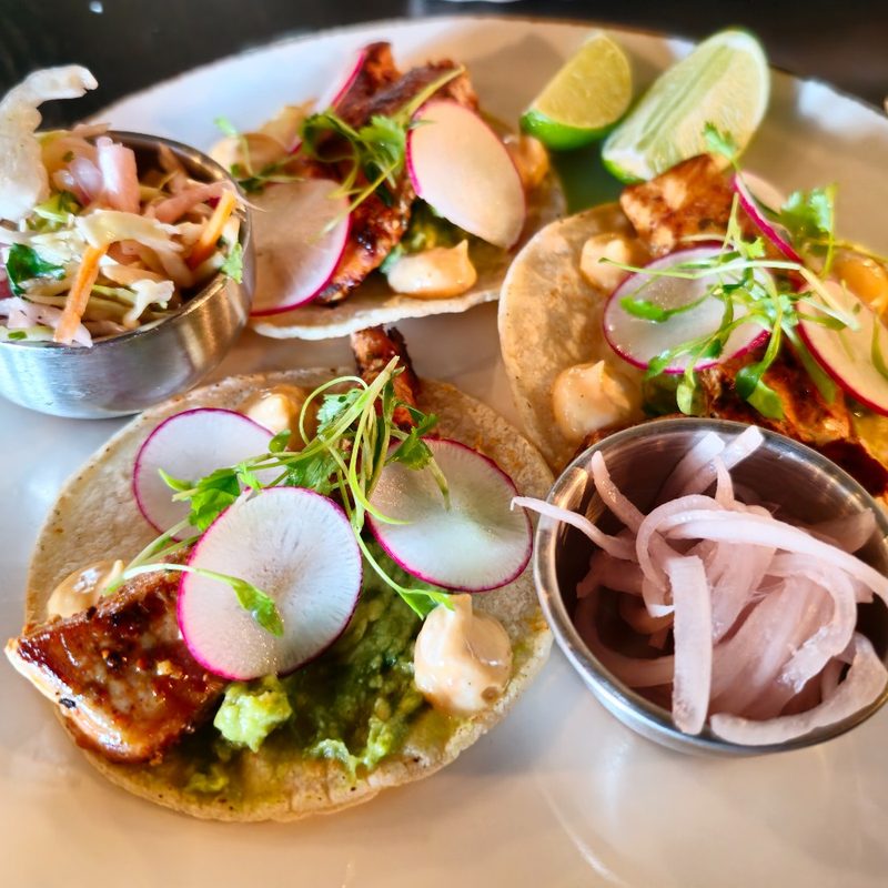 A plate of seafood tacos at the bar at the Four Seasons Resort Rancho Encantado Santa Fe in Santa Fe, New Mexico.