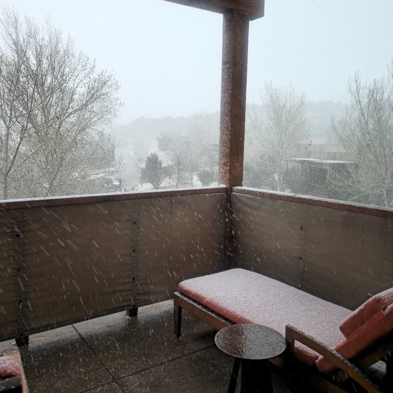 Snow falling on the patio of a casita at the Four Seasons Resort Rancho Encantado Santa Fe in Santa Fe, New Mexico.