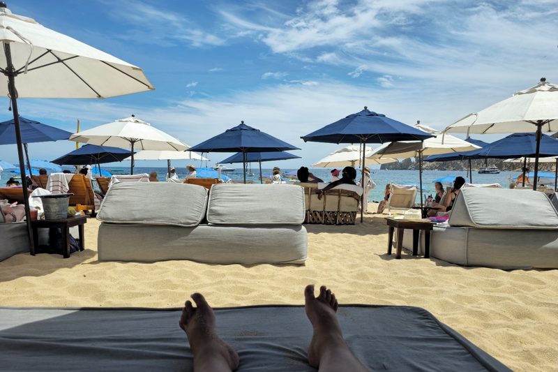 A view of the beach (and my feet) from Corazón Beach Club at Corazón Cabo Resort & Spa in Cabo San Lucas, Baja California Sur, Mexico.