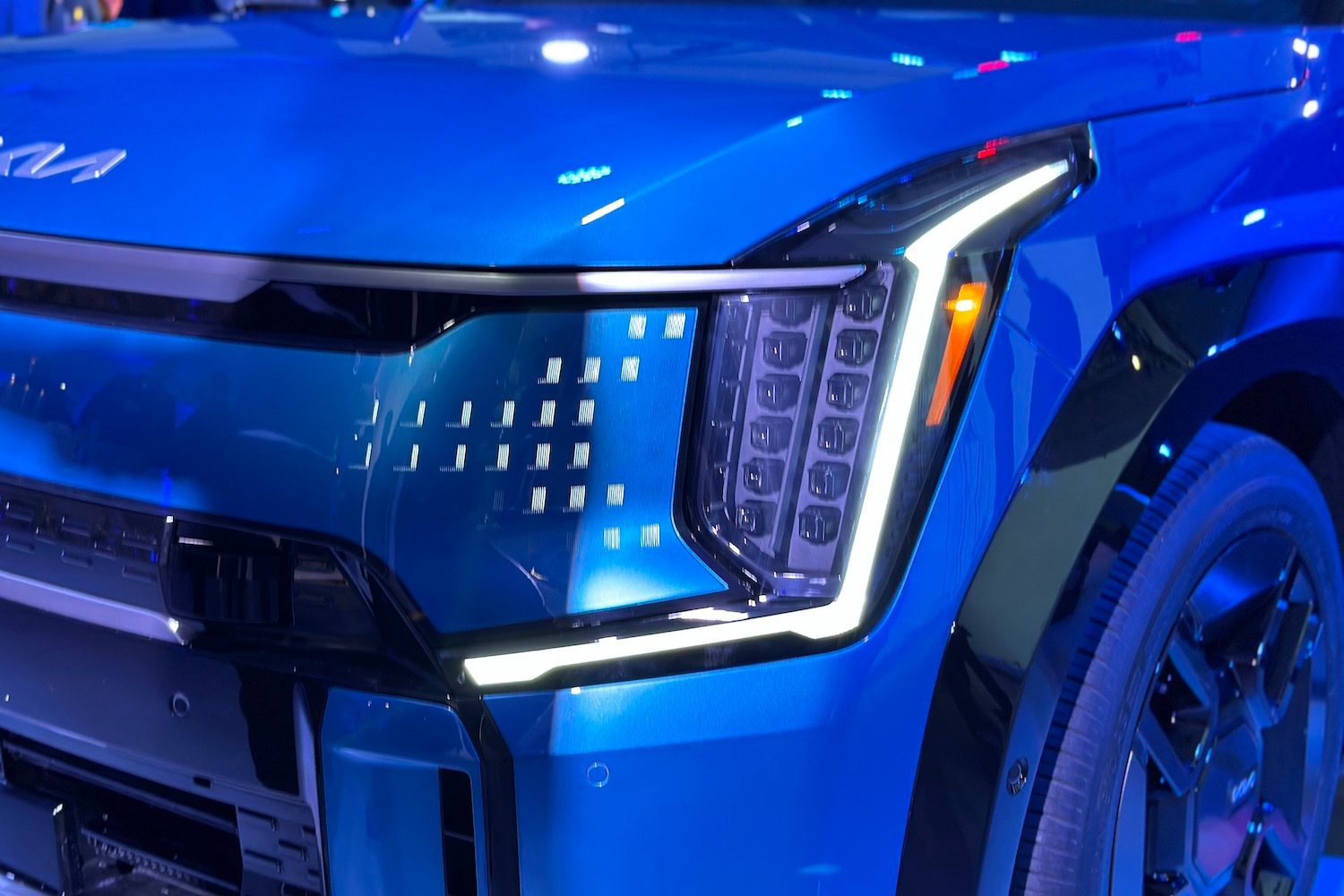 Close up of 2024 Kia EV9 headlight and front end.