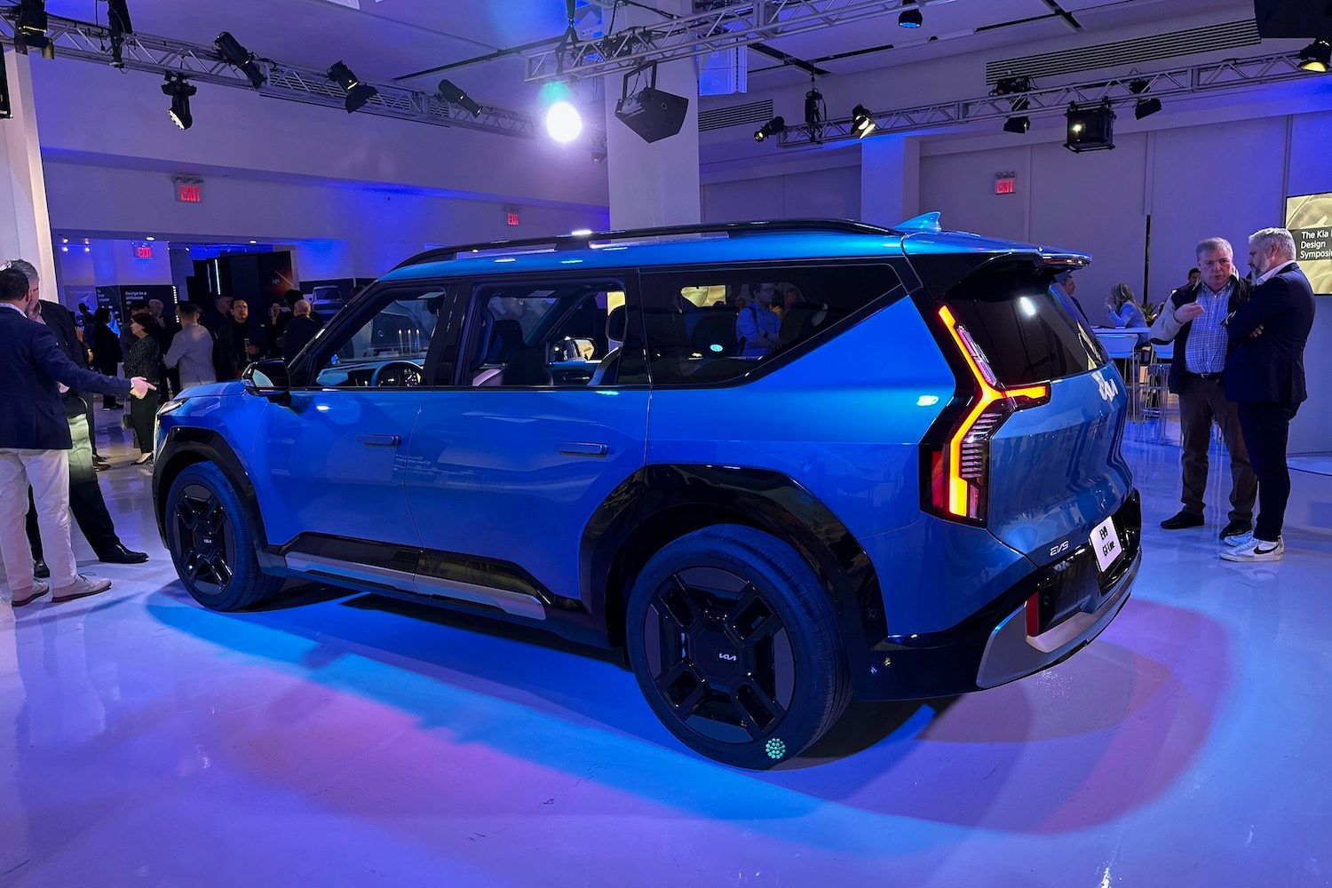 Rear end angle of the 2024 Kia EV9 in a studio.