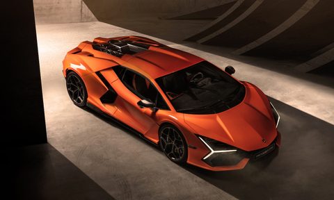 2024 Lamborghini Revuelto overhead front end angle parked in a garage with light in the back.