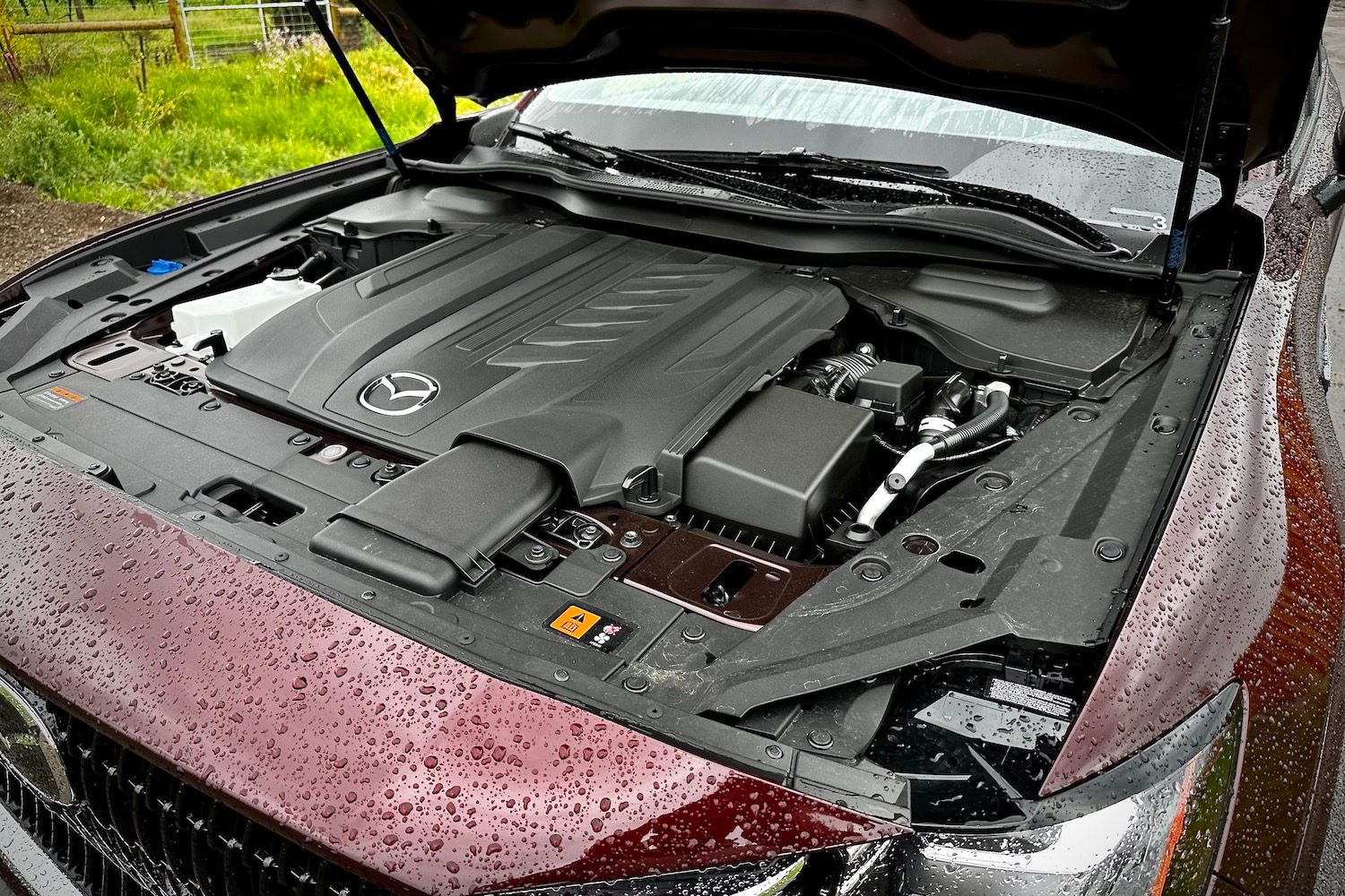 Close up of engine bay in the 2024 Mazda CX-90 six-cylinder inline engine.