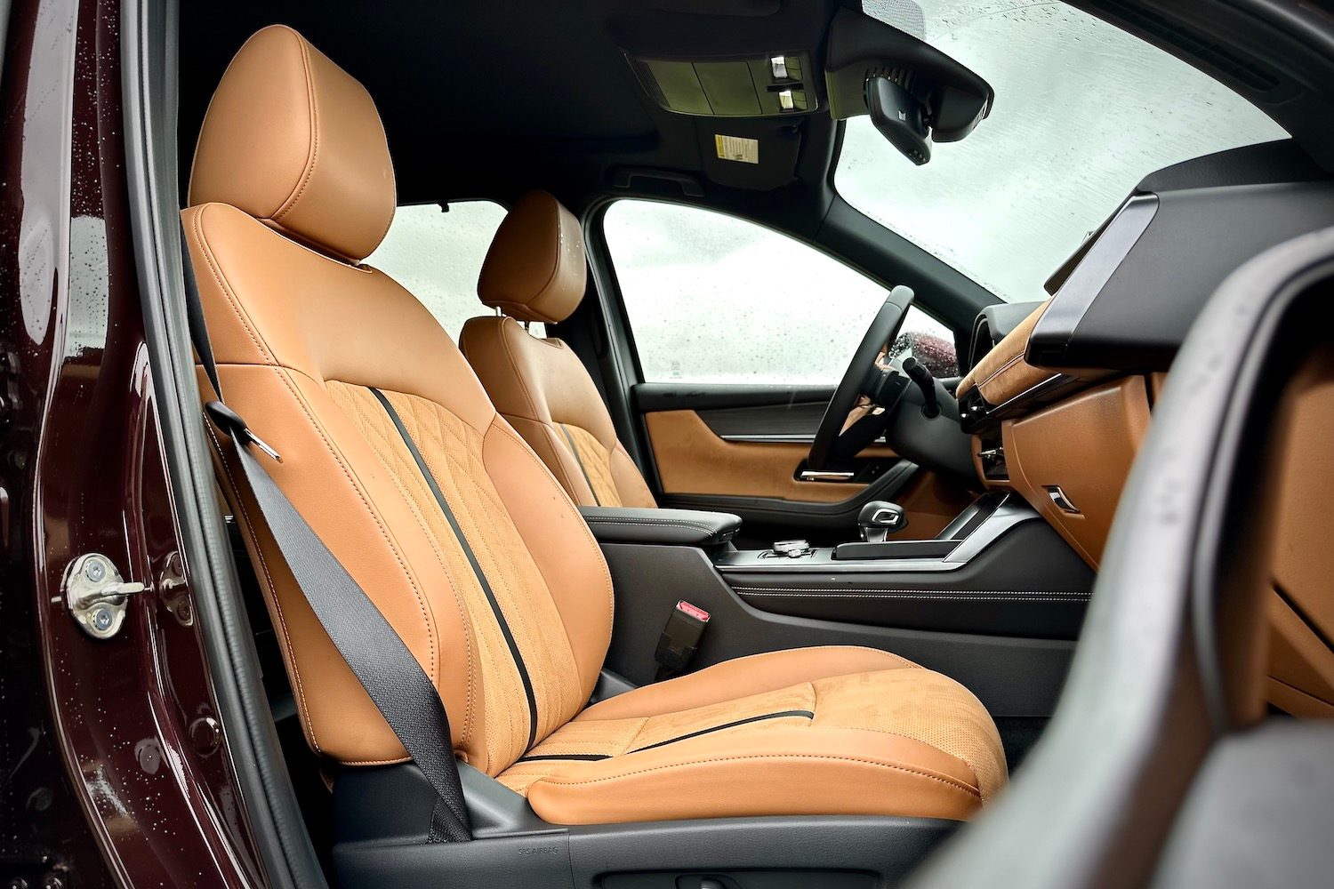 Side silhouette of the front seats in the 2024 Mazda CX-90 from passenger's side.
