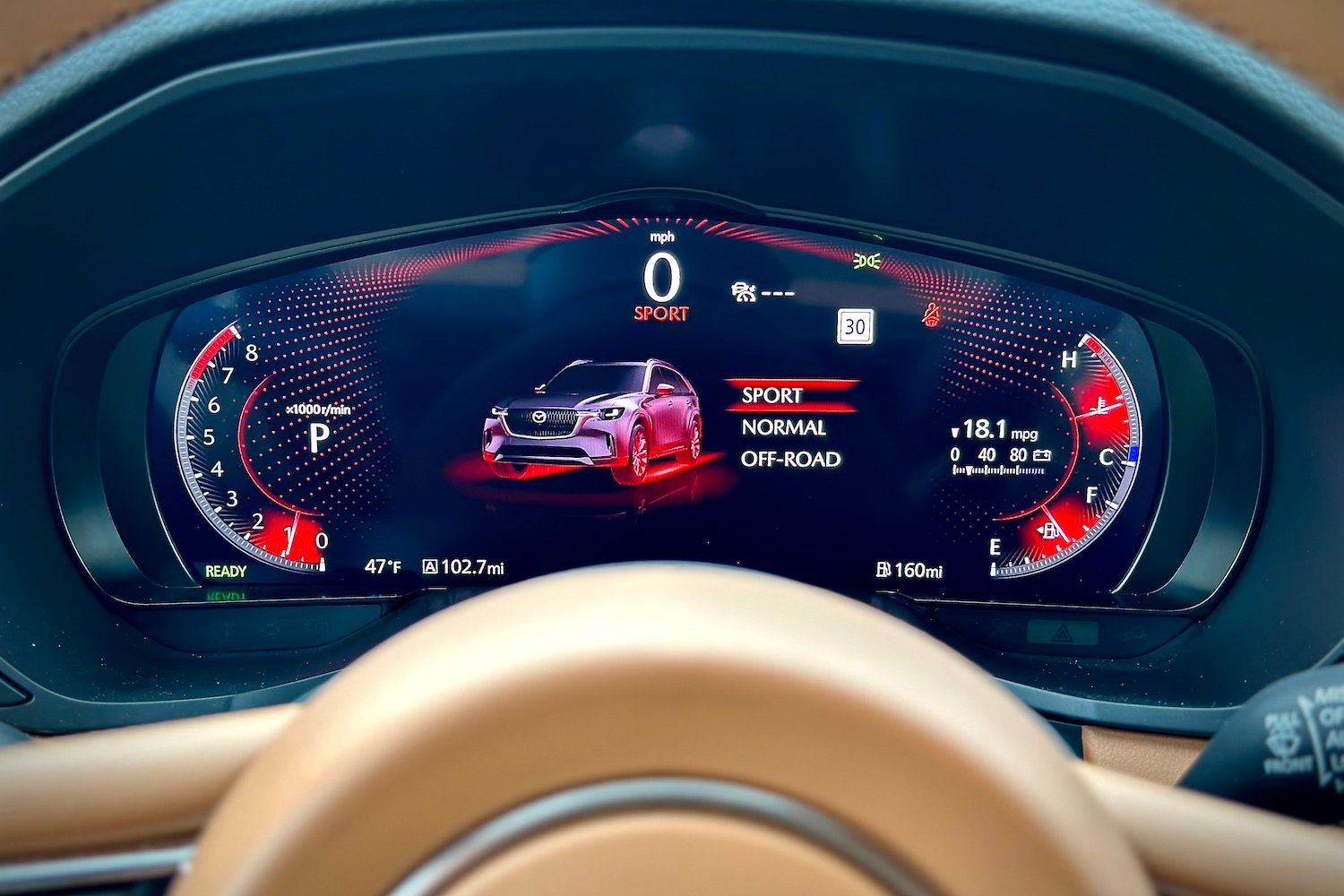 Close up of instrument cluster in the 2024 Mazda CX-90 with sport mode engaged.