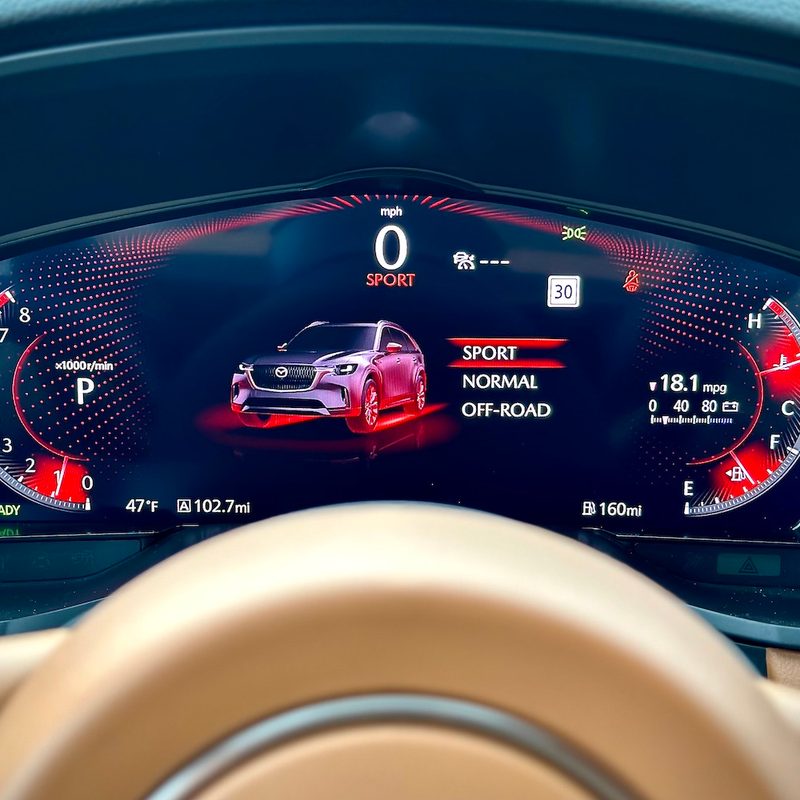 Close up of instrument cluster in the 2024 Mazda CX-90 with sport mode engaged.