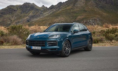 2024 Porsche Cayenne front end angle from driver's side parked in front of mountains.