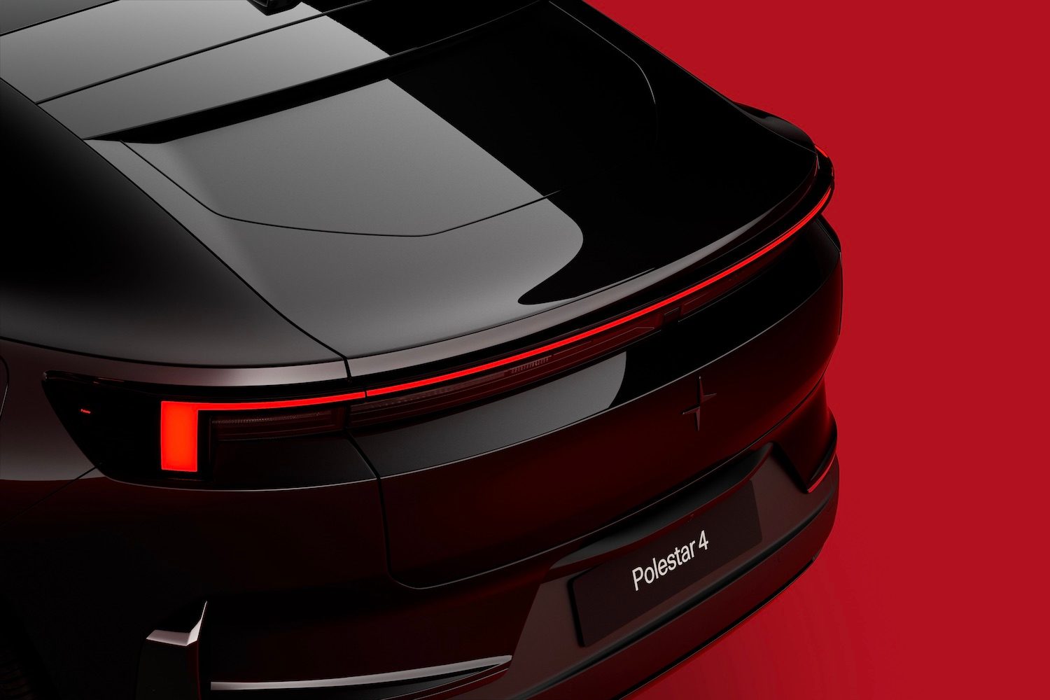2025 Polestar 4 close up of rear end from overhead in front of a red background.