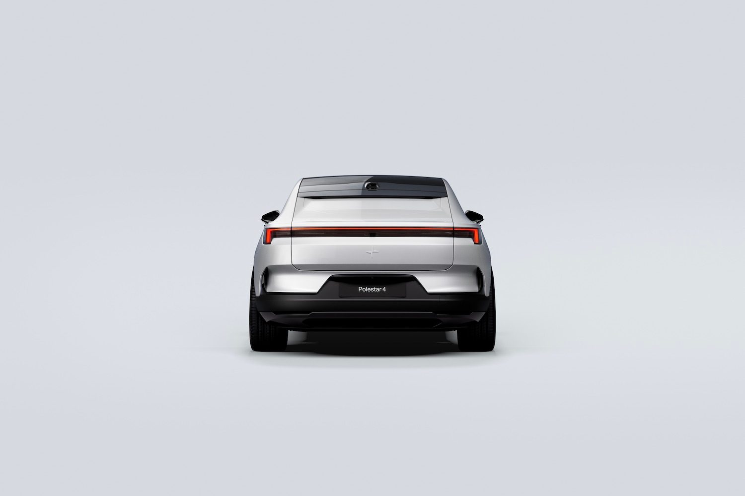 Close up of rear end of the 2025 Polestar 4 parked in front of a white background.
