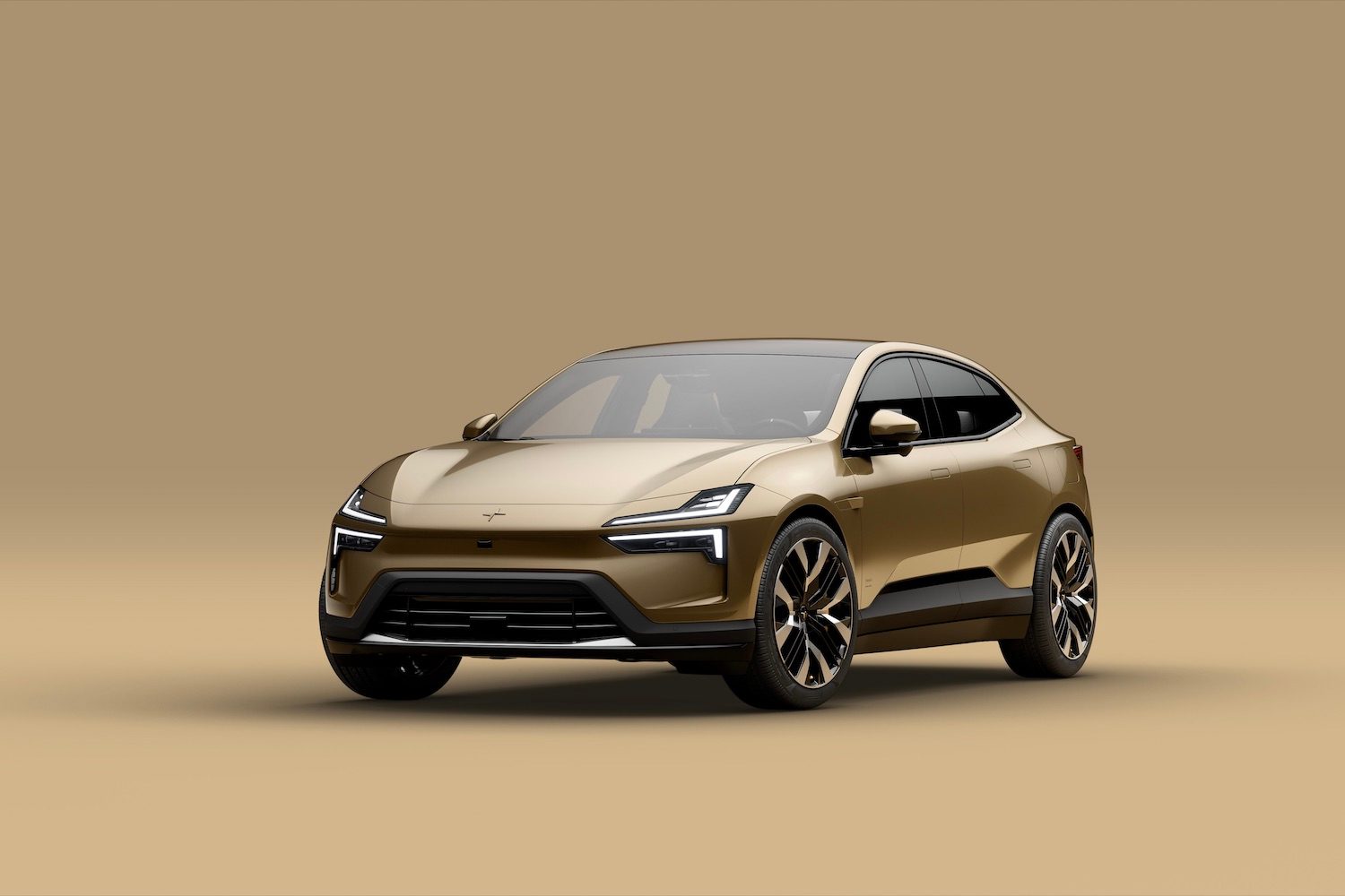 Front end angle of the 2025 Polestar 4 from the driver's side in font of a gold background.