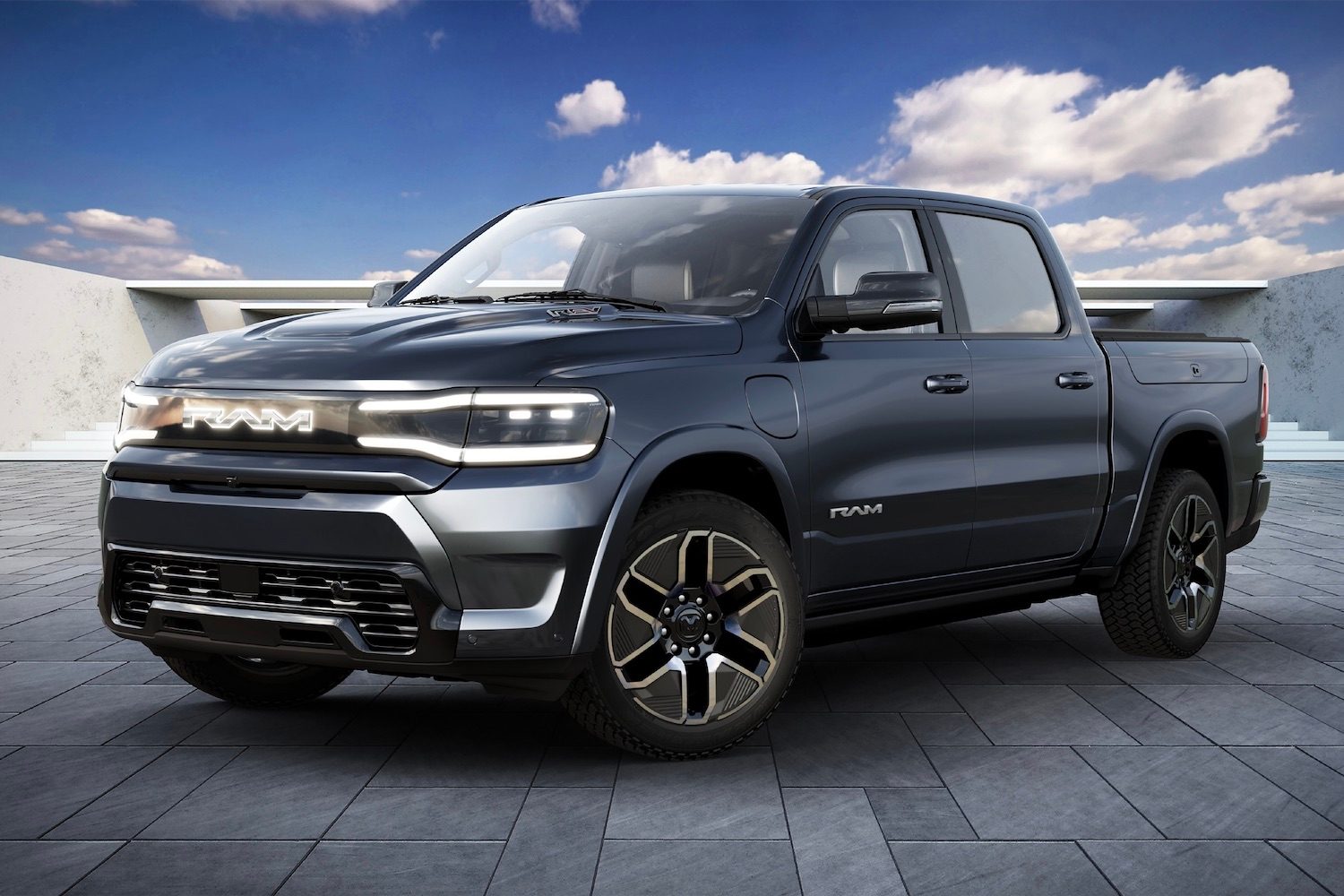2025 Ram 1500 REV front end rendering from driver's side with blue skies in the back.