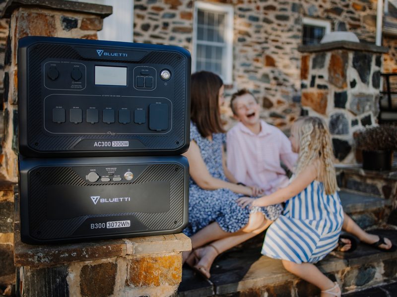 BLUETTI AC300 power station with family nearby