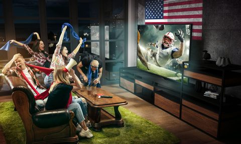 Friends watching football on TV