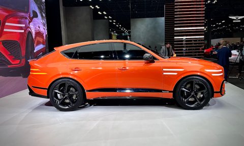 Genesis GV80 Coupe side profile of the SUV parked on stage.