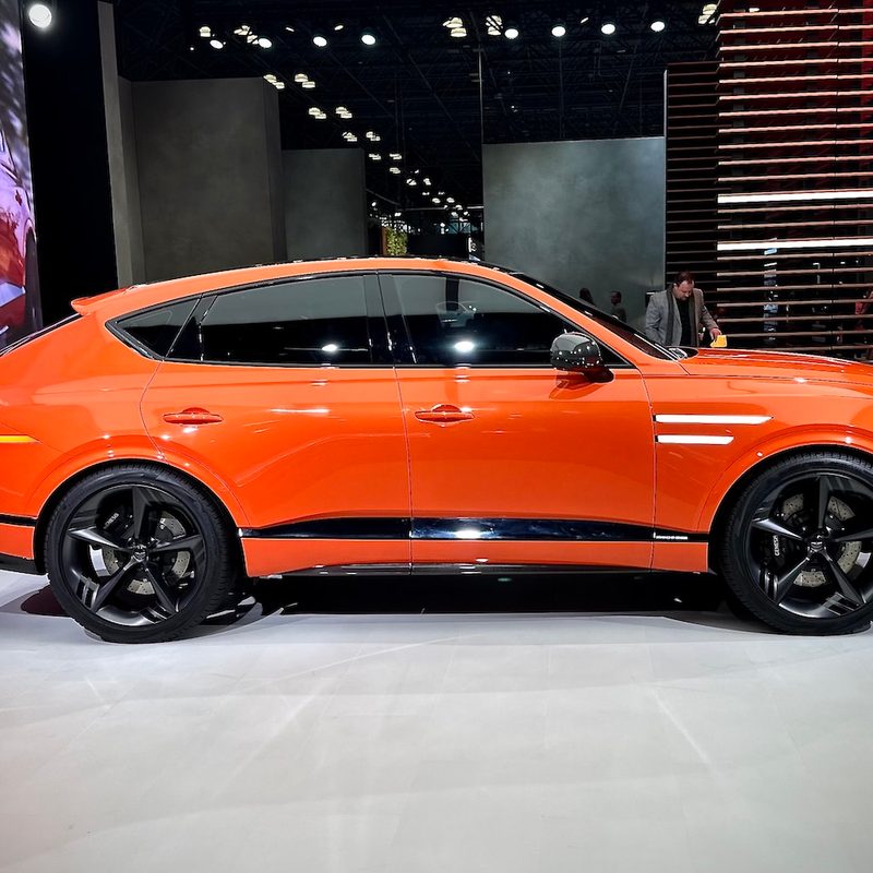 Genesis GV80 Coupe side profile of the SUV parked on stage.