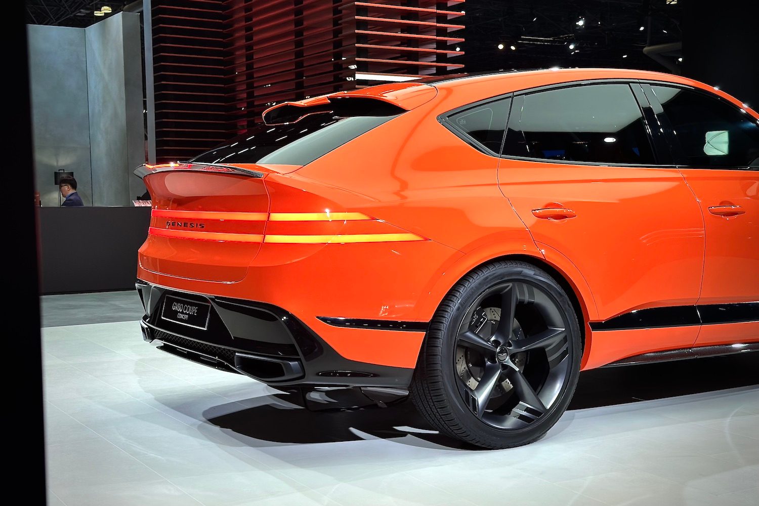 Rear end angle close up of the Genesis GV80 Coupe parked on a stage.