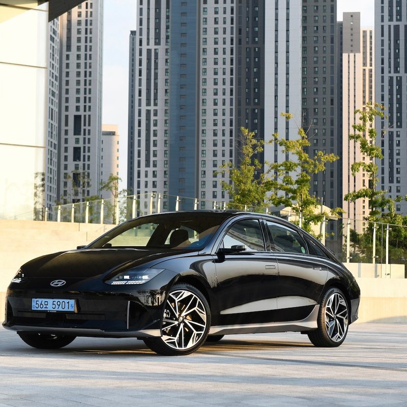2023 Hyundai IONIQ 6 front end angle parked in front of city buildings.
