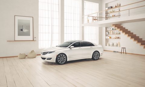 Lincoln MKZ Black Label parked inside of a building with large windows and hardwood floors.