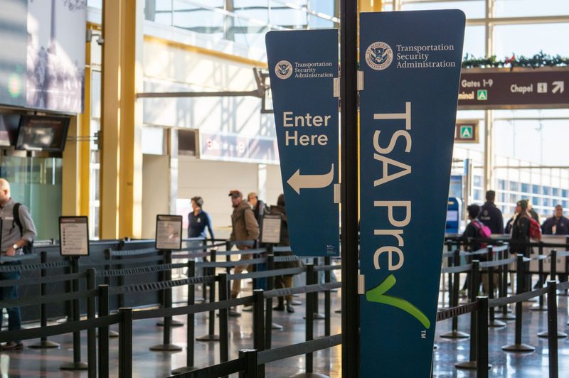 TSA PreCheck sign at airport.
