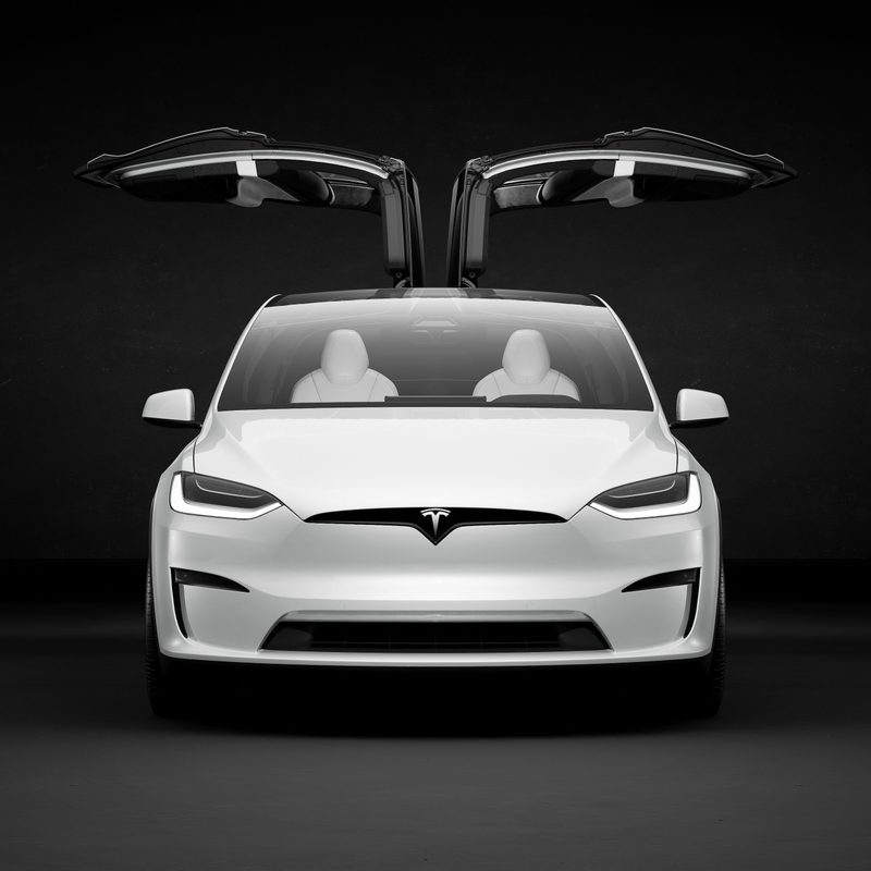 Close-up of the front end of the Tesla Model X with its rear doors open 