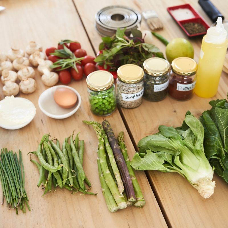 Vegetables on a table with other ingredients