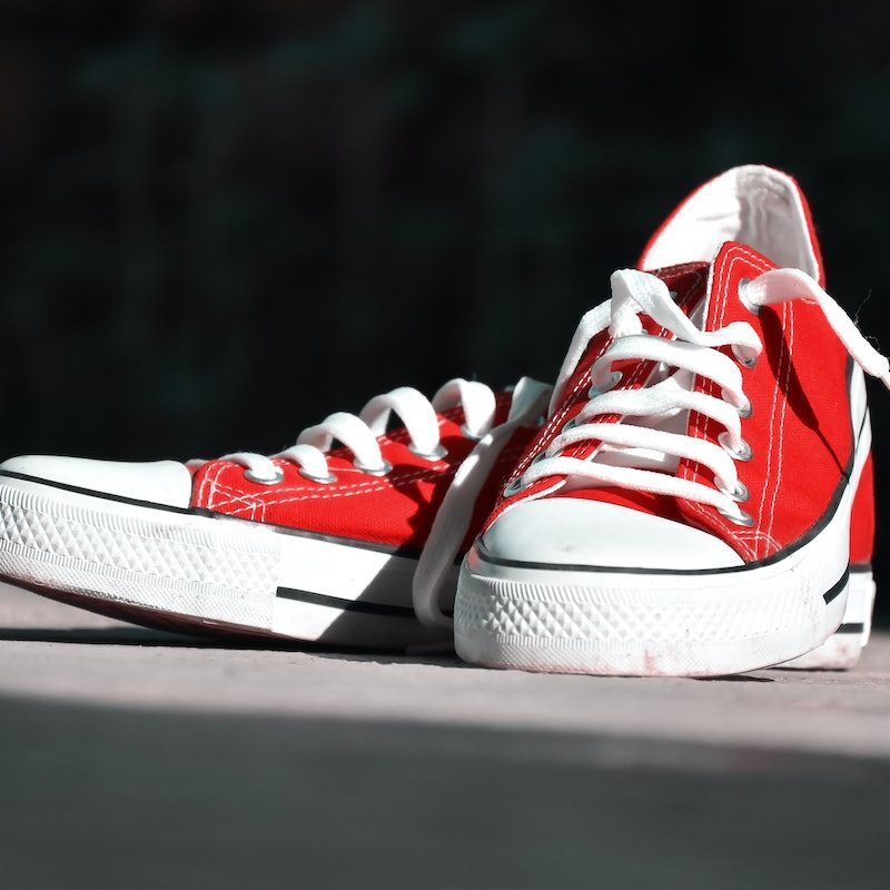 red canvas low top sneakers