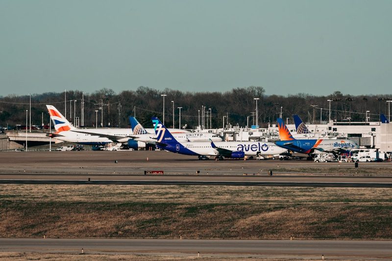 Various airplanes parked outside.