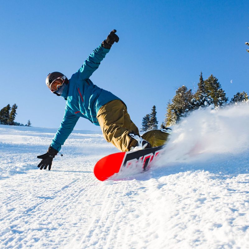 Snowboarder with orange board