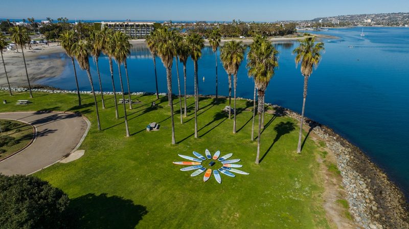 A circle of Isle SUPs laid out on the lawn on the island where they're made.