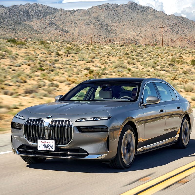 2023 BMW i7 driving on the road.