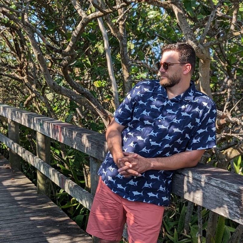 Man in UNTUCKit x David Hart summer collection in the woods