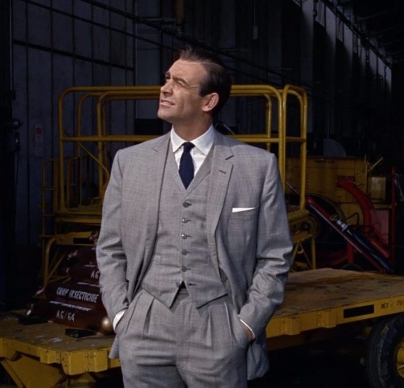 James Bond in Goldfinger wearing a Grey three piece