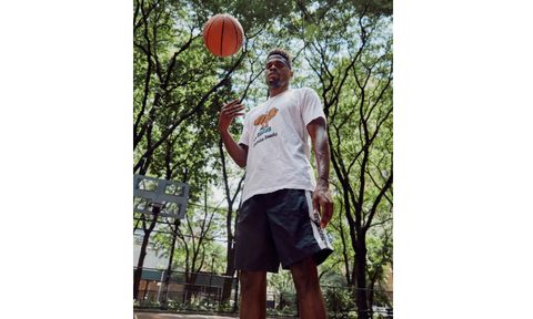 Nike Master Trainer Joe Holder outside on a basketball court.