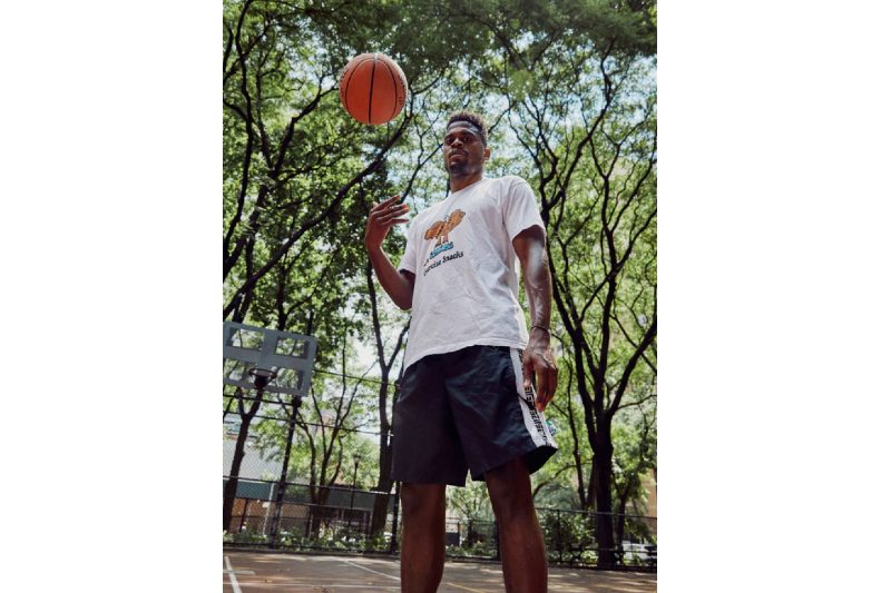 Nike Master Trainer Joe Holder outside on a basketball court.