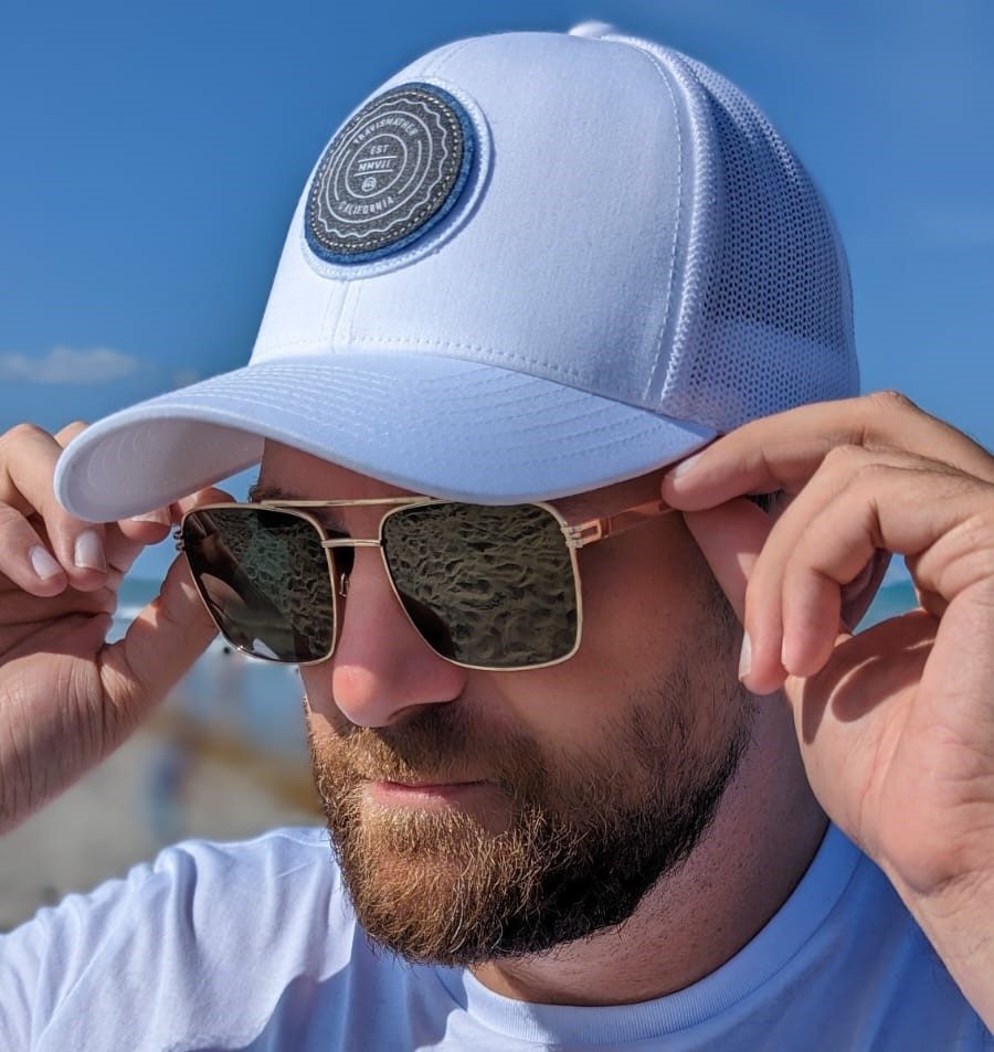 Man in Travis Mathew hat and Privé Revaux sunglasses