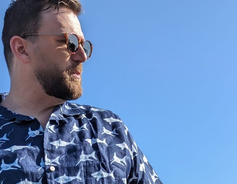 Man in UNTUCKit x David Hart shirt and glasses