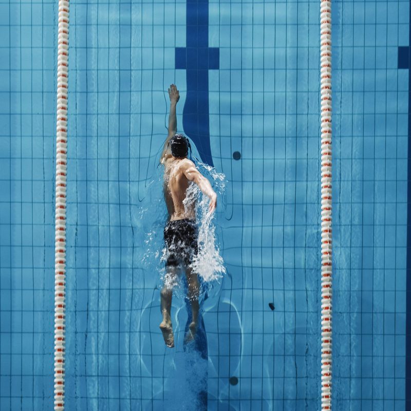 Man swimming freestyle.