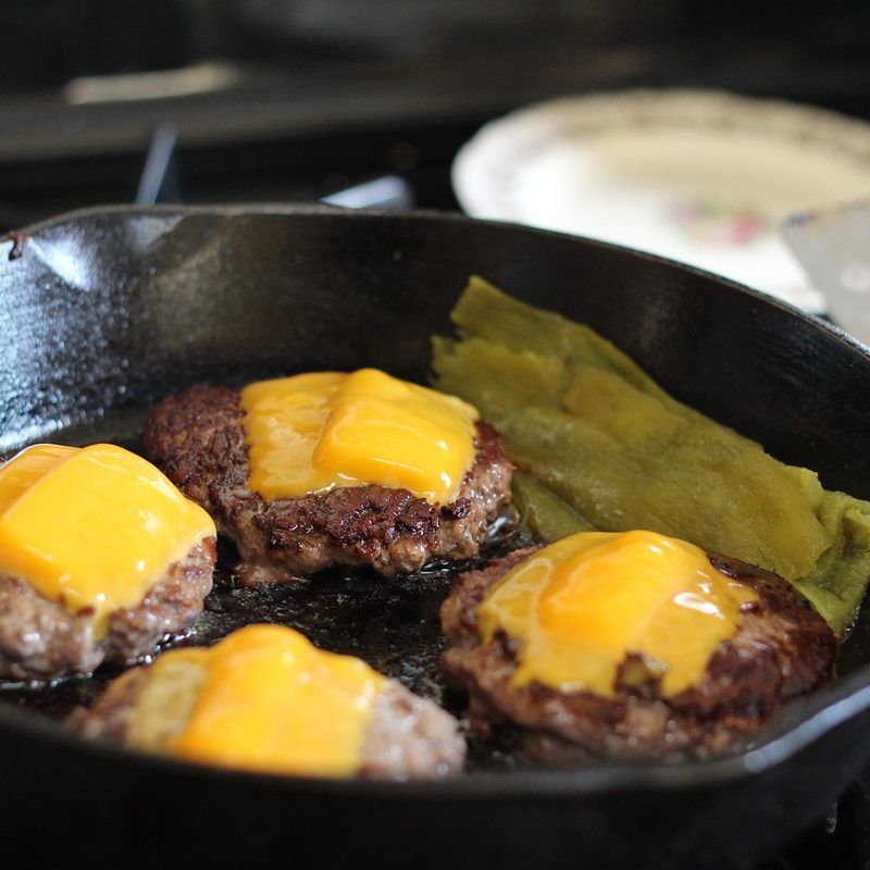 Cheeseburgers in skillet