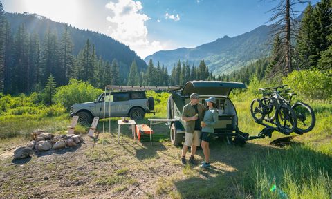 Couple camping with the new 2023 Escapod TOPO2 Teardrop Trailer.