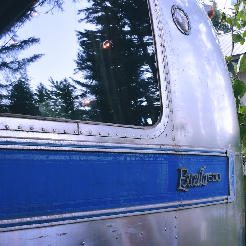Close-up of the nameplate on a vintage Airstream Excella 500 travel trailer.