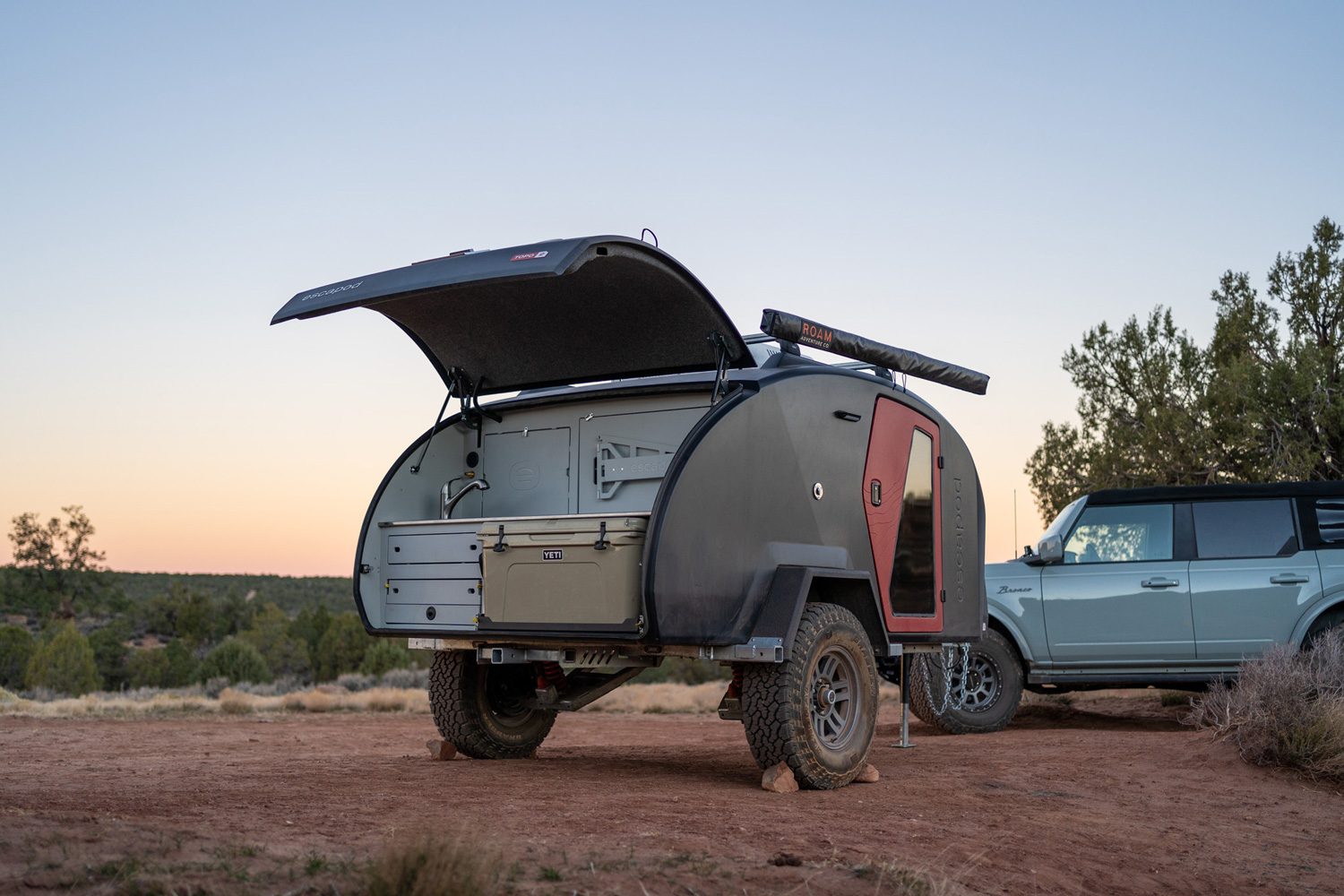 Open hatch revealing the compact camp kitchen of the Escapod TOPO2 Teardrop Trailer.