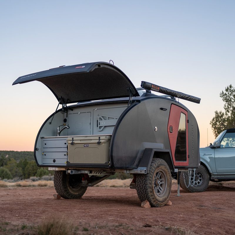 Open hatch revealing the compact camp kitchen of the Escapod TOPO2 Teardrop Trailer.