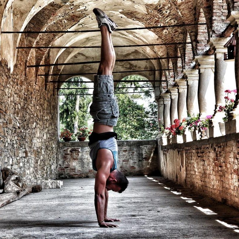 Man doing a handstand.