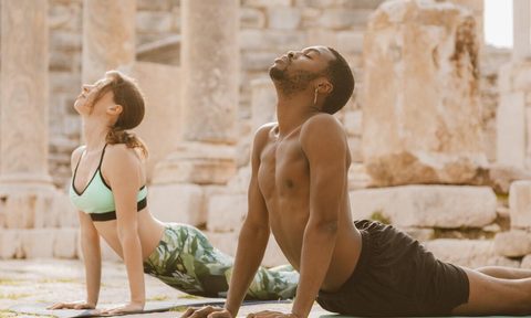 Man and woman doing yoga
